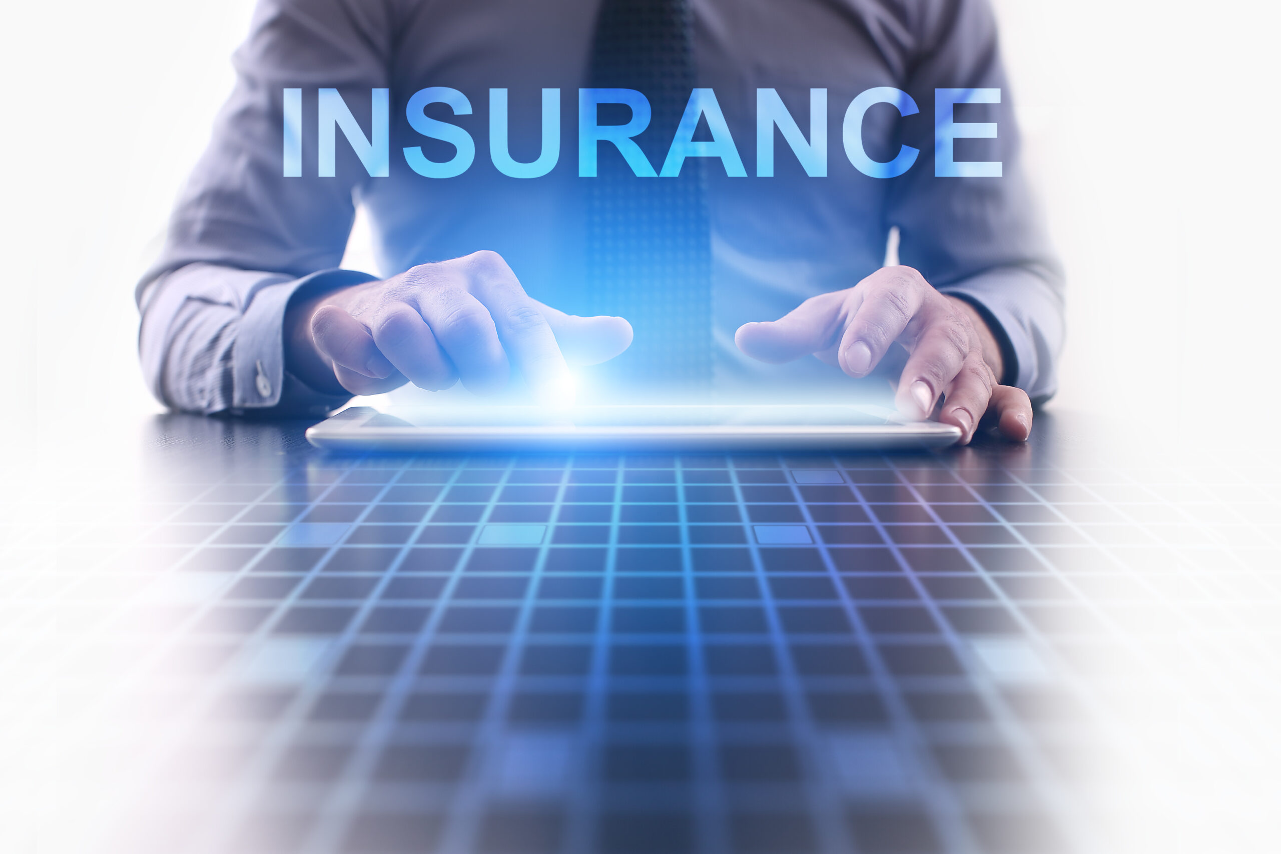 Businessman using modern tablet pc and selecting Insurance.