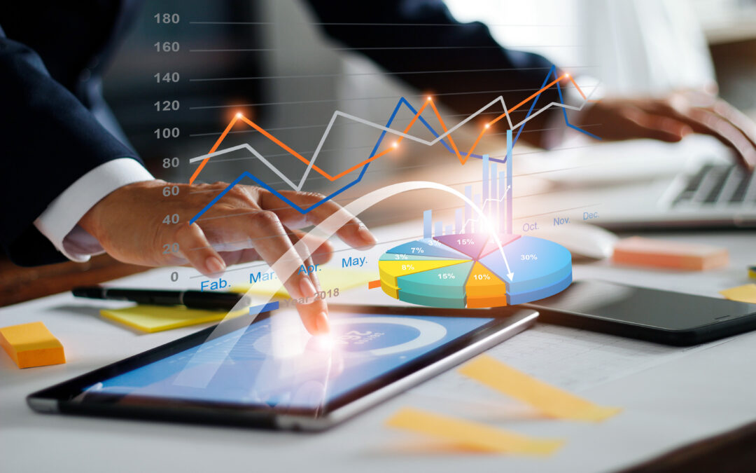 Businessman using tablet and laptop analyzing sales data and economic growth graph chart. Business strategy. Digital marketing. Business innovation technology concept